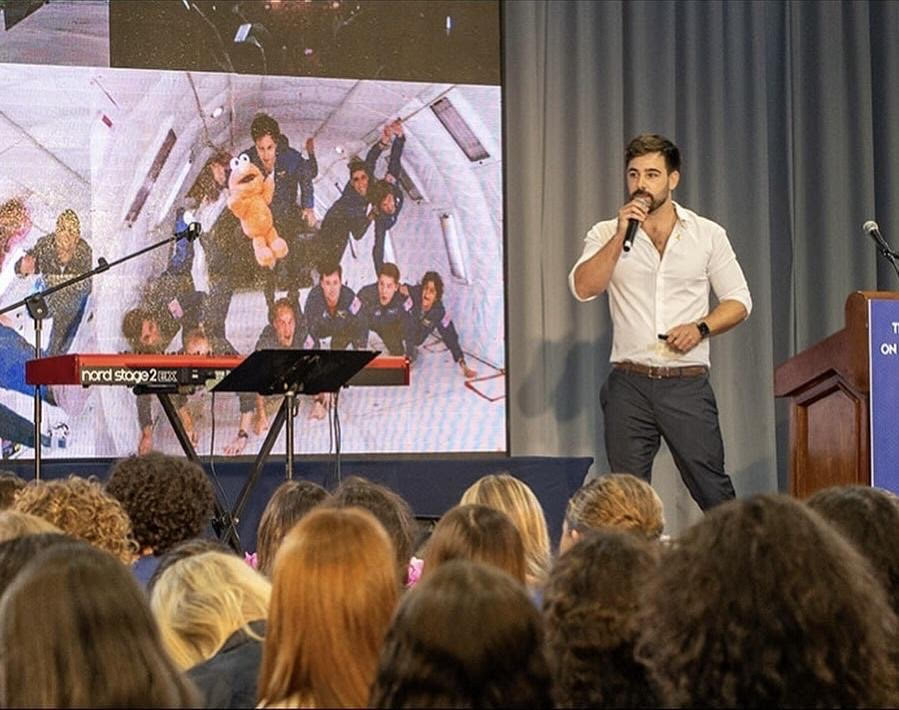 Tal Ramon speaking on stage